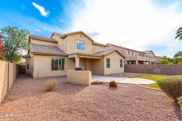 back of property featuring a patio