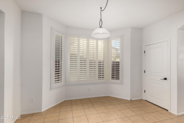 spare room with light tile patterned floors