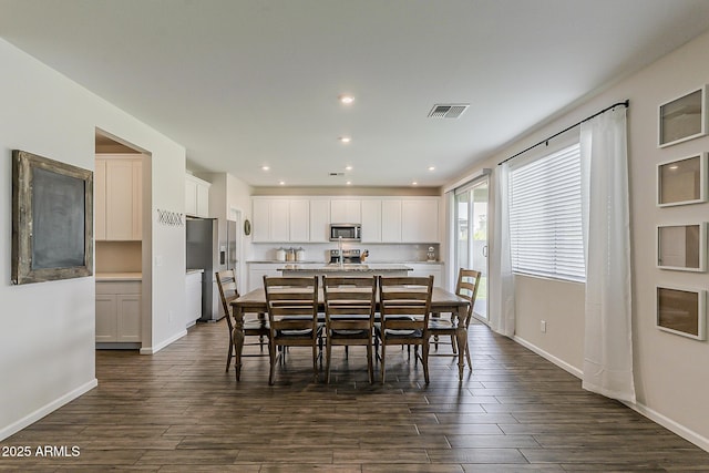 dining room featuring recessed lighting, dark wood finished floors, visible vents, and baseboards