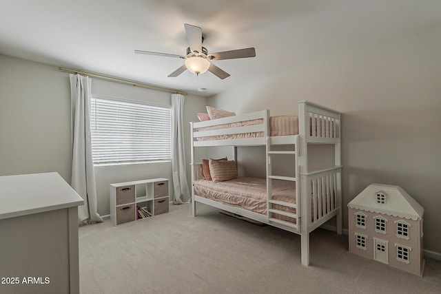 bedroom featuring baseboards, carpet flooring, and ceiling fan