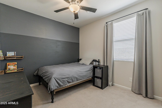 bedroom with ceiling fan, carpet floors, and baseboards