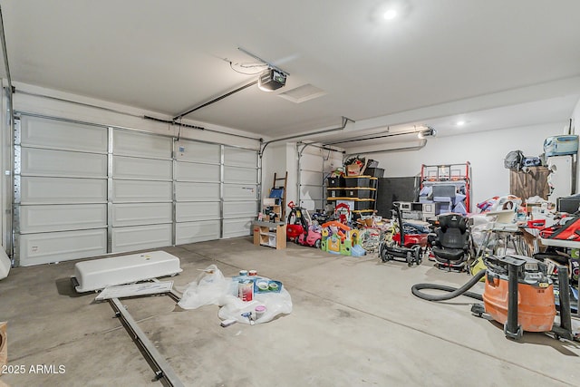 garage featuring a garage door opener