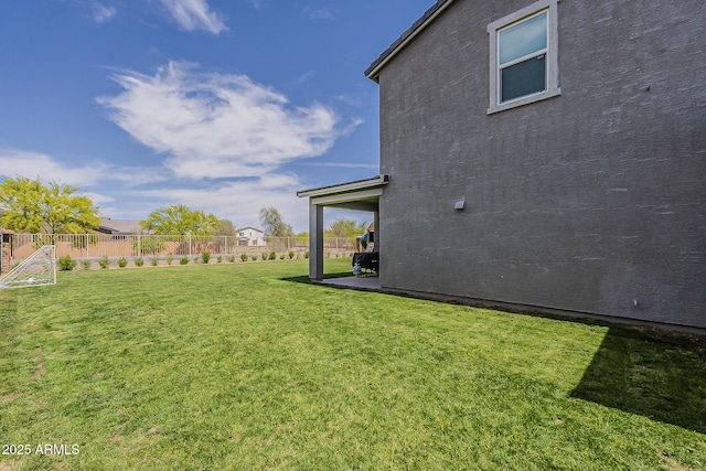 view of yard with a patio and fence