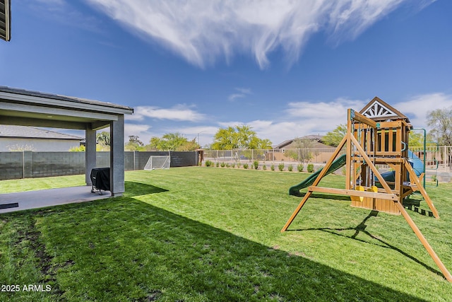 view of yard featuring a fenced backyard and a playground