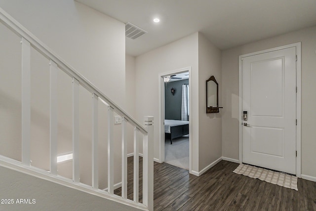 entrance foyer with baseboards, wood finished floors, visible vents, and recessed lighting