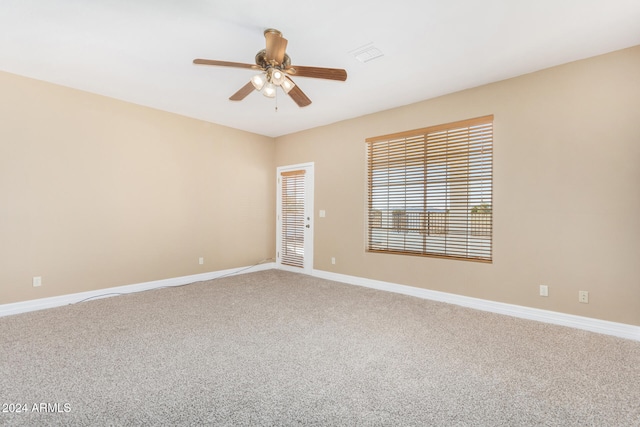 carpeted empty room featuring ceiling fan