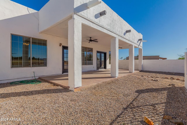 rear view of house featuring a patio and ceiling fan