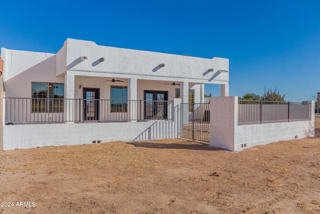 pueblo-style home with french doors and ceiling fan