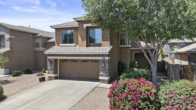 1162 E Ranch Ct, Gilbert, AZ 85296 - view of front facade featuring stucco siding, a garage, concrete driveway, and stone siding