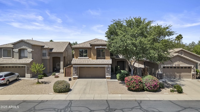 1162 E Ranch Ct, Gilbert, AZ 85296 - view of front facade featuring driveway, stone siding, stucco siding, a tile roof, and an attached garage