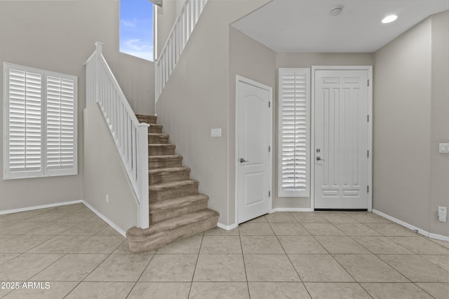 1162 E Ranch Ct, Gilbert, AZ 85296 - foyer with light tile patterned floors, baseboards, and stairs