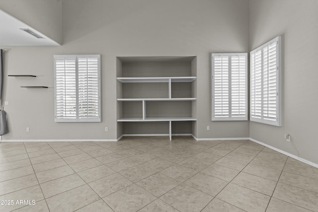 1162 E Ranch Ct, Gilbert, AZ 85296 - spare room with tile patterned flooring, baseboards, and built in features