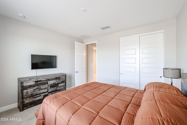 carpeted bedroom with a closet