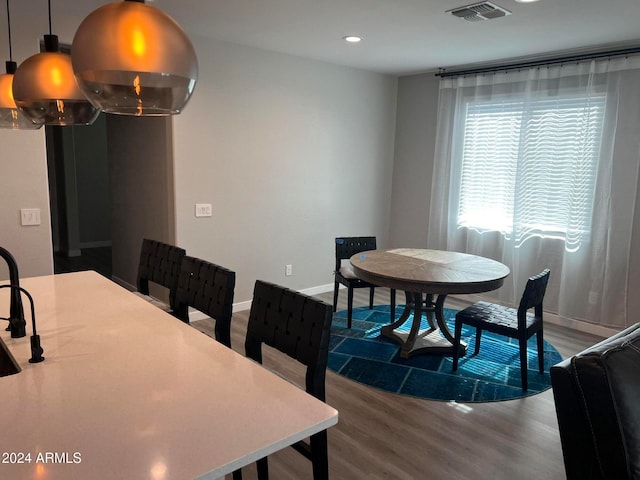 dining space featuring hardwood / wood-style floors