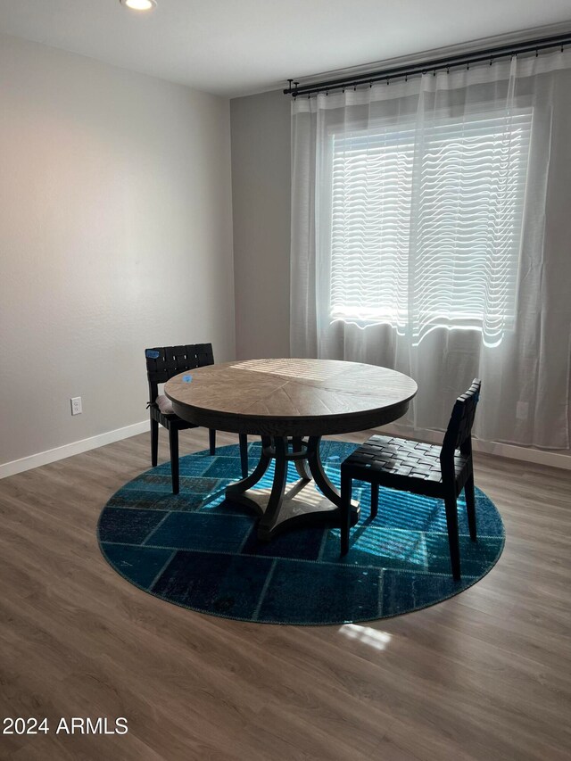 dining area featuring hardwood / wood-style floors