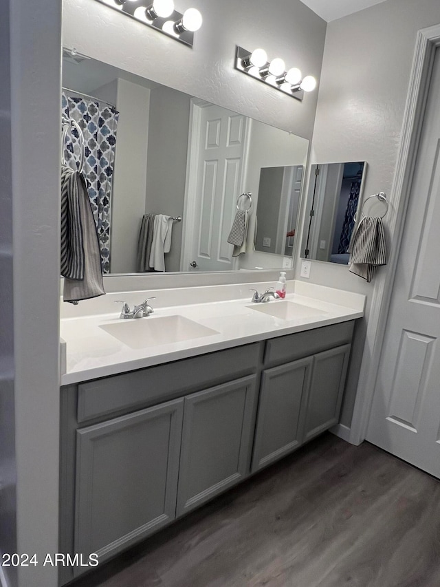 bathroom featuring vanity and hardwood / wood-style flooring