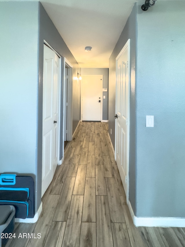 corridor featuring light hardwood / wood-style flooring