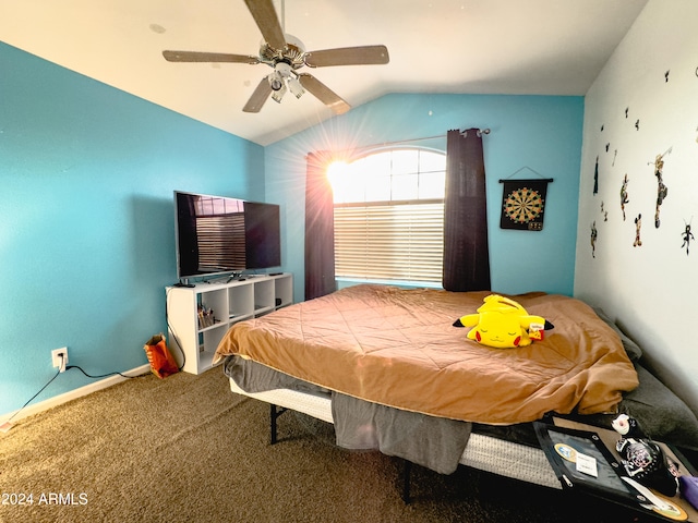 carpeted bedroom featuring ceiling fan and vaulted ceiling