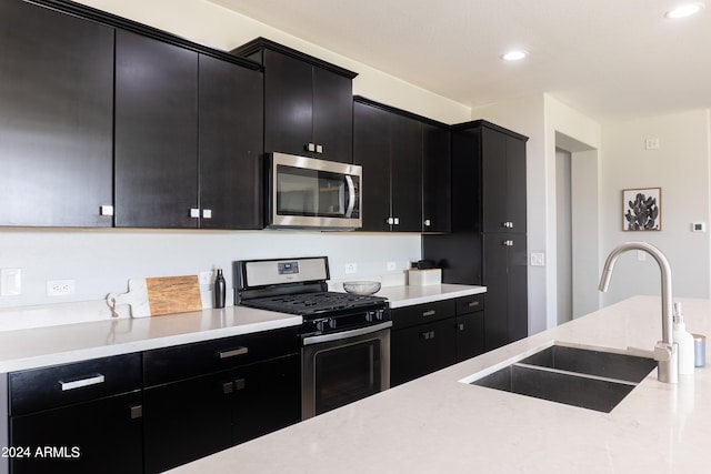 kitchen with sink and appliances with stainless steel finishes