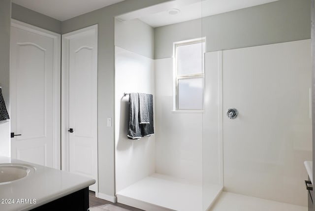 bathroom featuring vanity and walk in shower