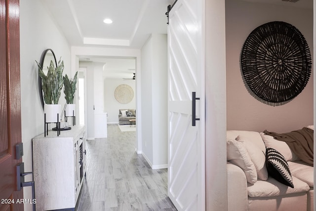 hallway with light hardwood / wood-style flooring