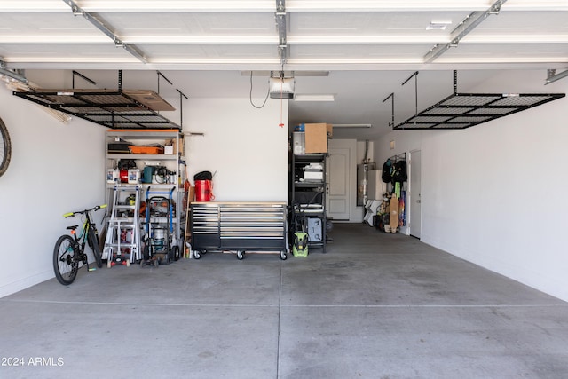 garage featuring a carport, gas water heater, and a garage door opener