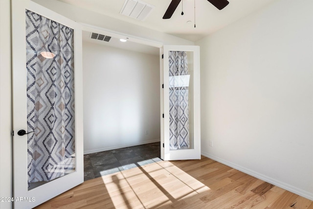 foyer with wood-type flooring and ceiling fan