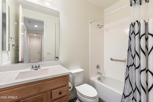 full bathroom with shower / bath combo, vanity, and toilet