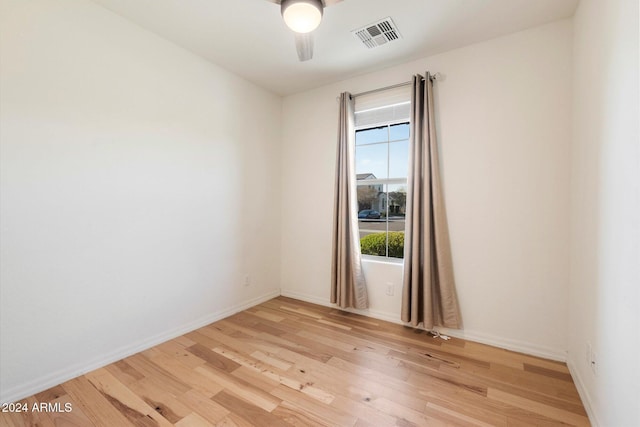 spare room featuring ceiling fan and light hardwood / wood-style floors