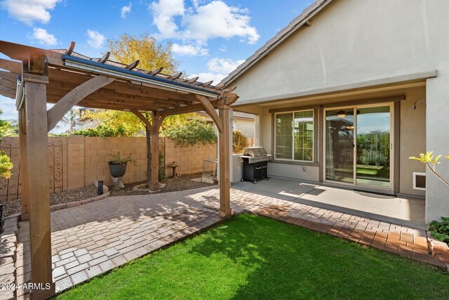 29007 N 120th Dr, Peoria, AZ 85383 - view of patio with grilling area, a pergola, and fence