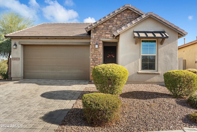 29007 N 120th Dr, Peoria, AZ 85383 - view of front facade with a tiled roof, a garage, decorative driveway, and stucco siding