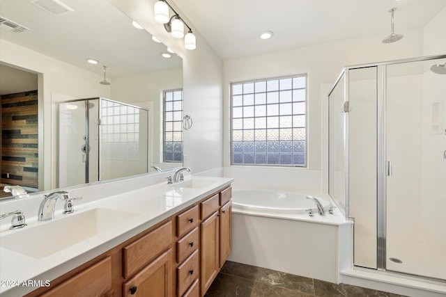 bathroom featuring vanity and separate shower and tub