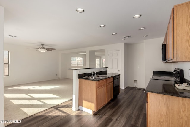 kitchen with visible vents, dark countertops, black appliances, a sink, and recessed lighting