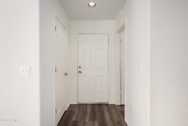 corridor with dark wood-style flooring