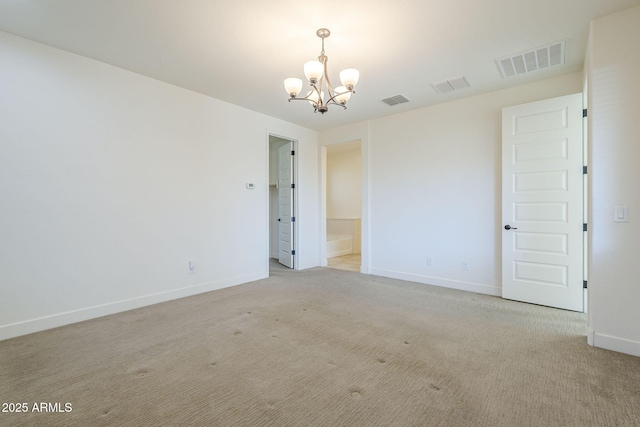 unfurnished room featuring a chandelier, baseboards, and light colored carpet