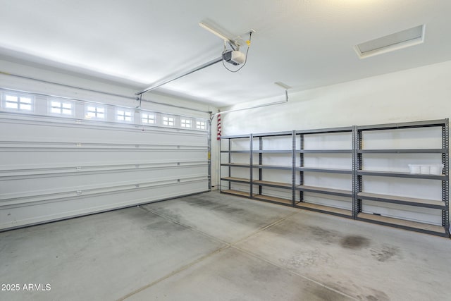 garage featuring a garage door opener