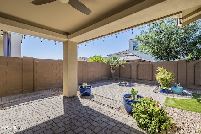 view of patio with ceiling fan and a fenced backyard