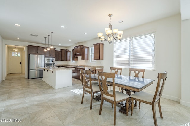 dining room featuring plenty of natural light, baseboards, a chandelier, and recessed lighting