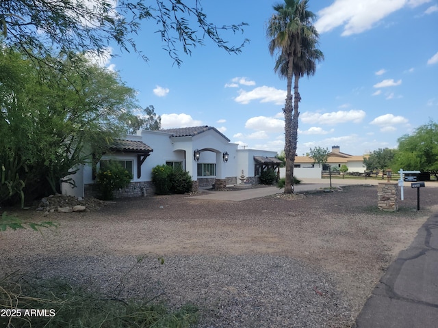 12210 N 67th St, Scottsdale, AZ 85254 - mediterranean / spanish-style home featuring stucco siding and a tiled roof