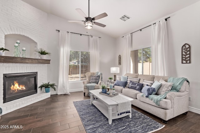 14864 W Riviera Dr, Surprise, AZ 85379 - living area with a ceiling fan, wood finished floors, a fireplace, and high vaulted ceiling
