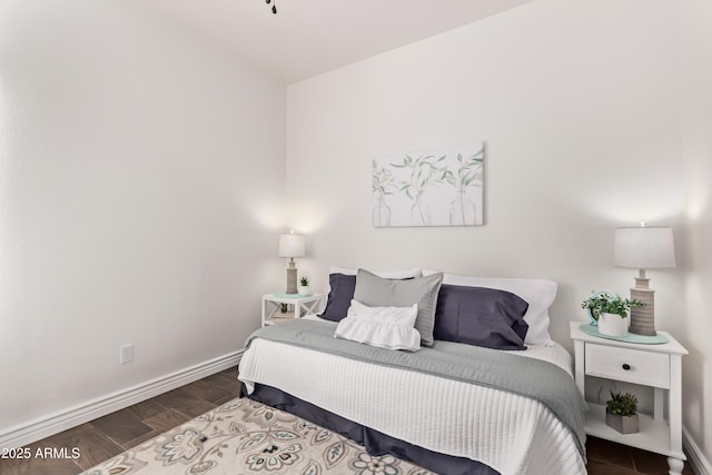 14864 W Riviera Dr, Surprise, AZ 85379 - bedroom featuring wood finished floors and baseboards