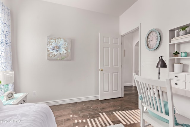 14864 W Riviera Dr, Surprise, AZ 85379 - bedroom with wood tiled floors and arched walkways