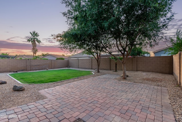 14864 W Riviera Dr, Surprise, AZ 85379 - patio terrace at dusk featuring a patio and a fenced backyard