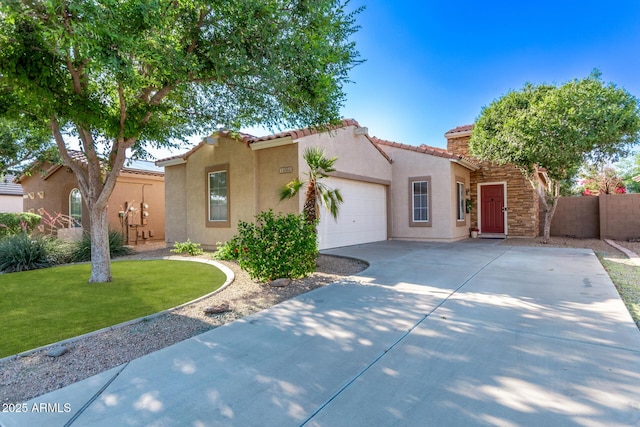 14864 W Riviera Dr, Surprise, AZ 85379 - mediterranean / spanish-style house featuring stucco siding, driveway, an attached garage, and a tiled roof