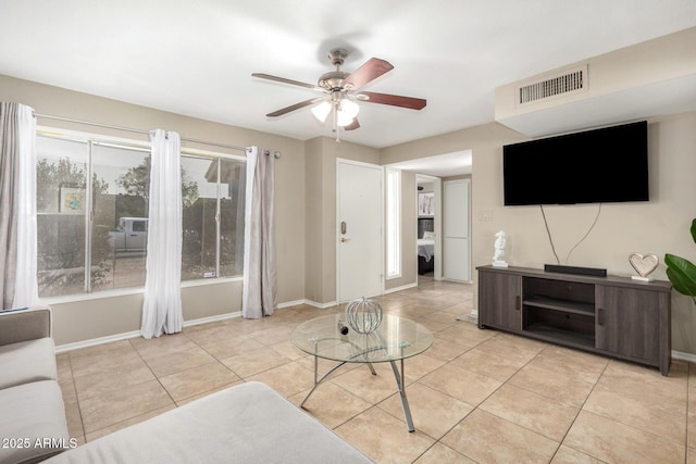 9028 W Osborn Rd, Phoenix, AZ 85037 - living area with ceiling fan, baseboards, visible vents, and light tile patterned floors