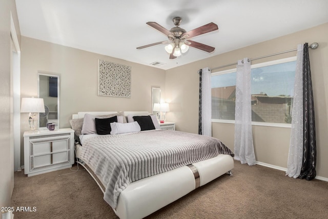 9028 W Osborn Rd, Phoenix, AZ 85037 - carpeted bedroom with baseboards, a ceiling fan, and visible vents