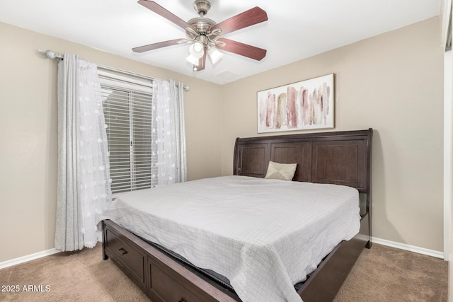 9028 W Osborn Rd, Phoenix, AZ 85037 - bedroom featuring ceiling fan, baseboards, and light colored carpet