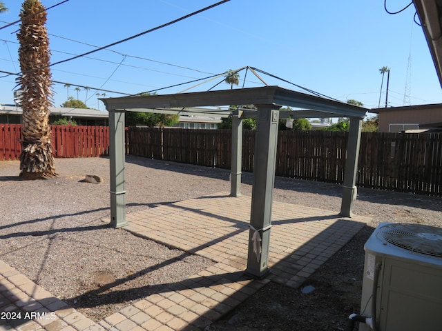 view of patio with cooling unit and a gazebo