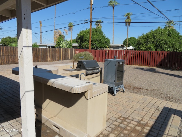 view of patio with a grill