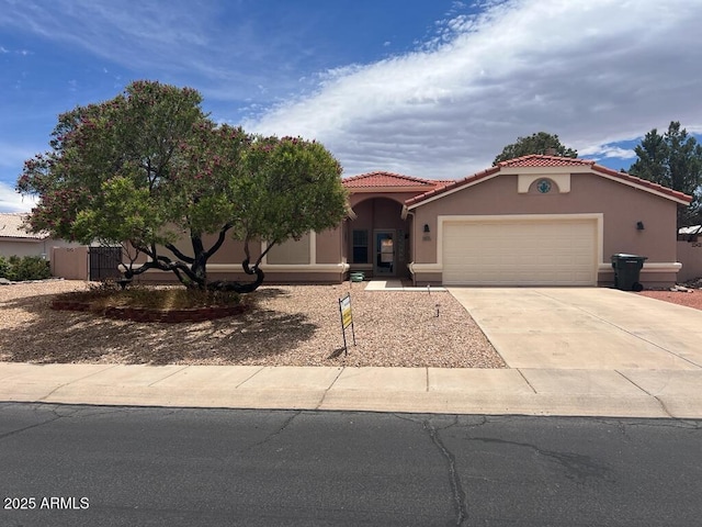 3876 Camino Del Vara, Sierra Vista, AZ 85650 - view of front of property with a garage, concrete driveway, stucco siding, and a tile roof